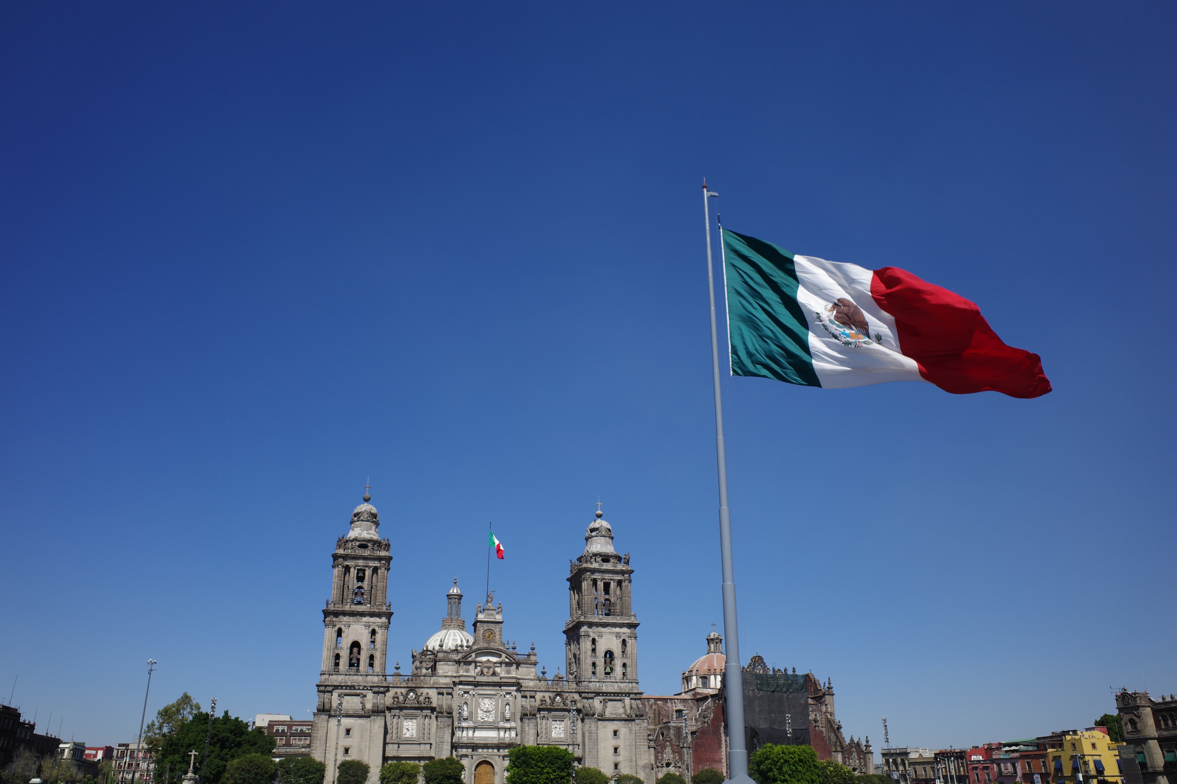Mexico City's Zocalo — the Metropolitan Cathedral, the giant flag, the energy that earned CDMX the GOAT spot.